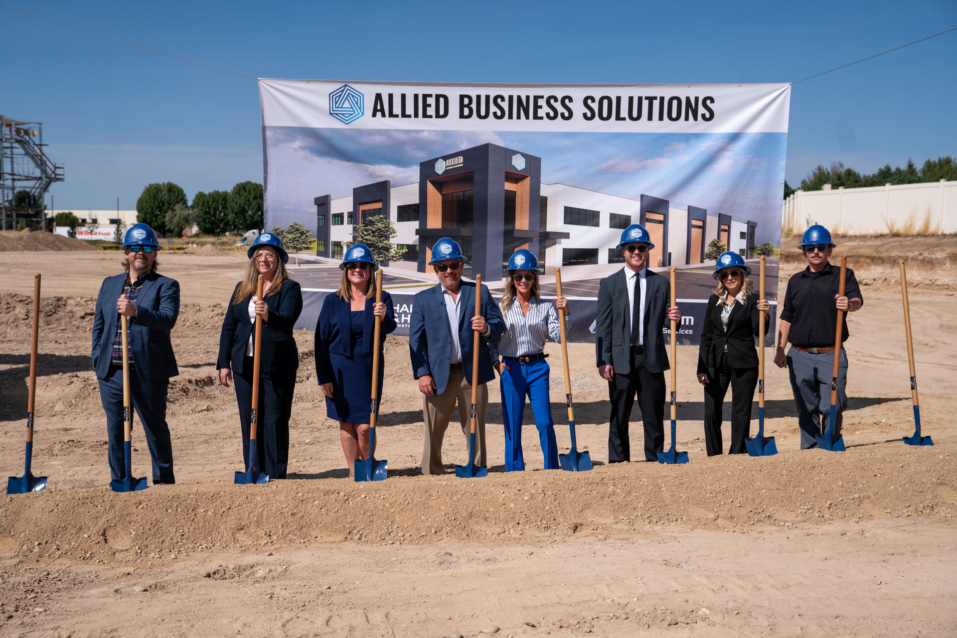 Tom Beeles and the Allied Business Solutions team turn dirt with ceremonial shovels at the Meridian headquarters groundbreaking.